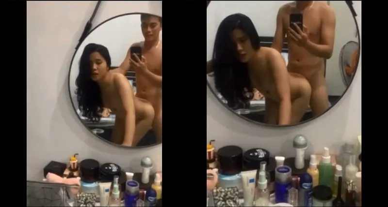 Phang học sinh nữ xinh như hoa trước gương